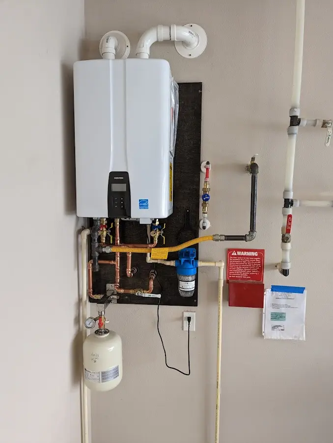 Professional plumber installing copper piping in a Palacios home